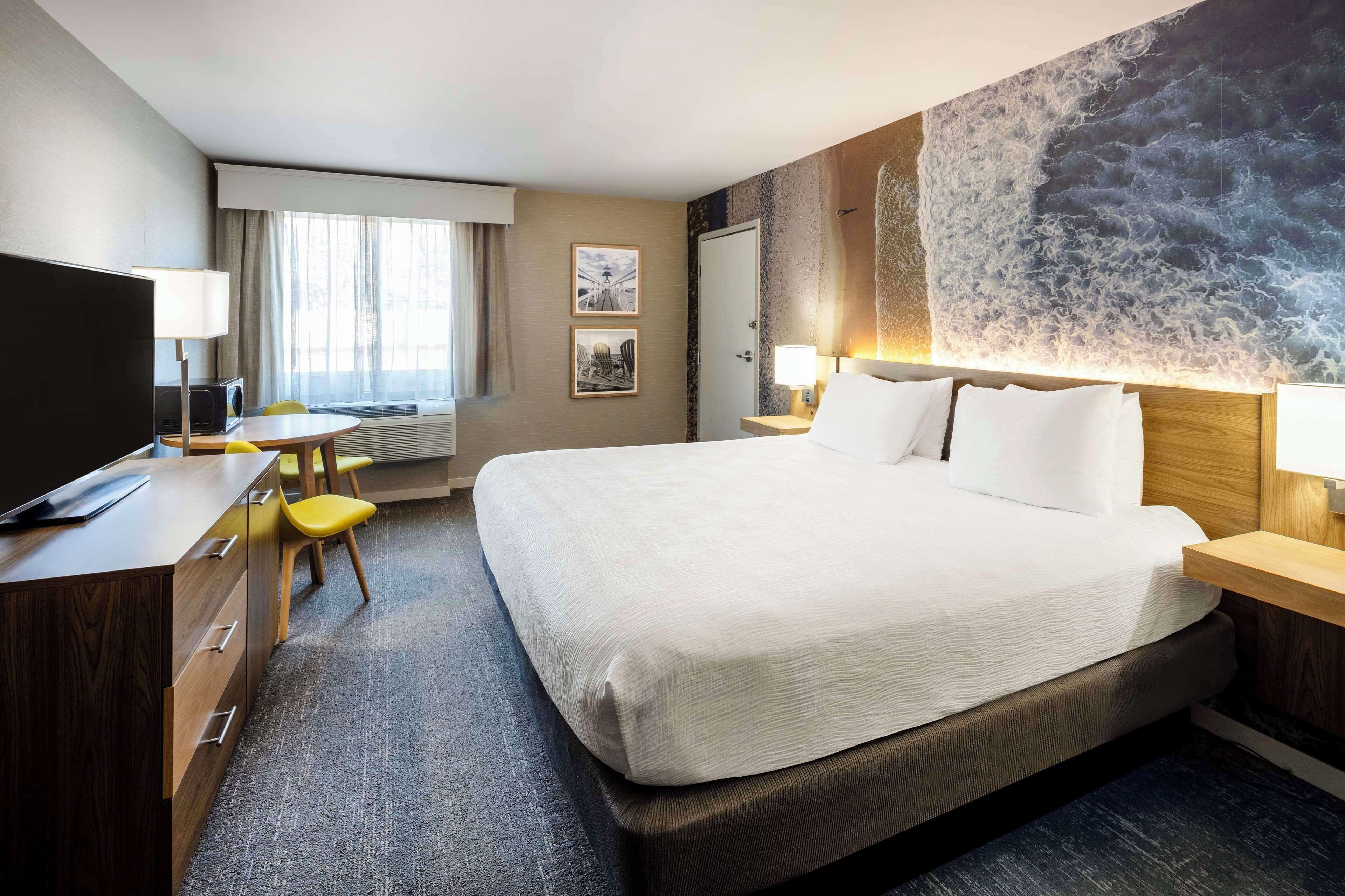 premium bedding, desk, laptop workspace, blackout curtains