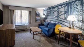 Premium bedding, desk, laptop workspace, blackout drapes