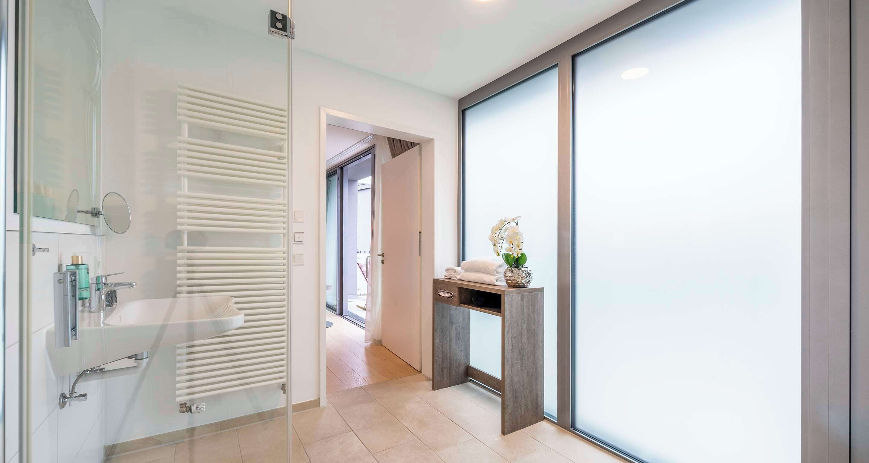 junior suite, 1 king bed, sauna | bathroom | shower, rainfall showerhead, hair dryer, towels