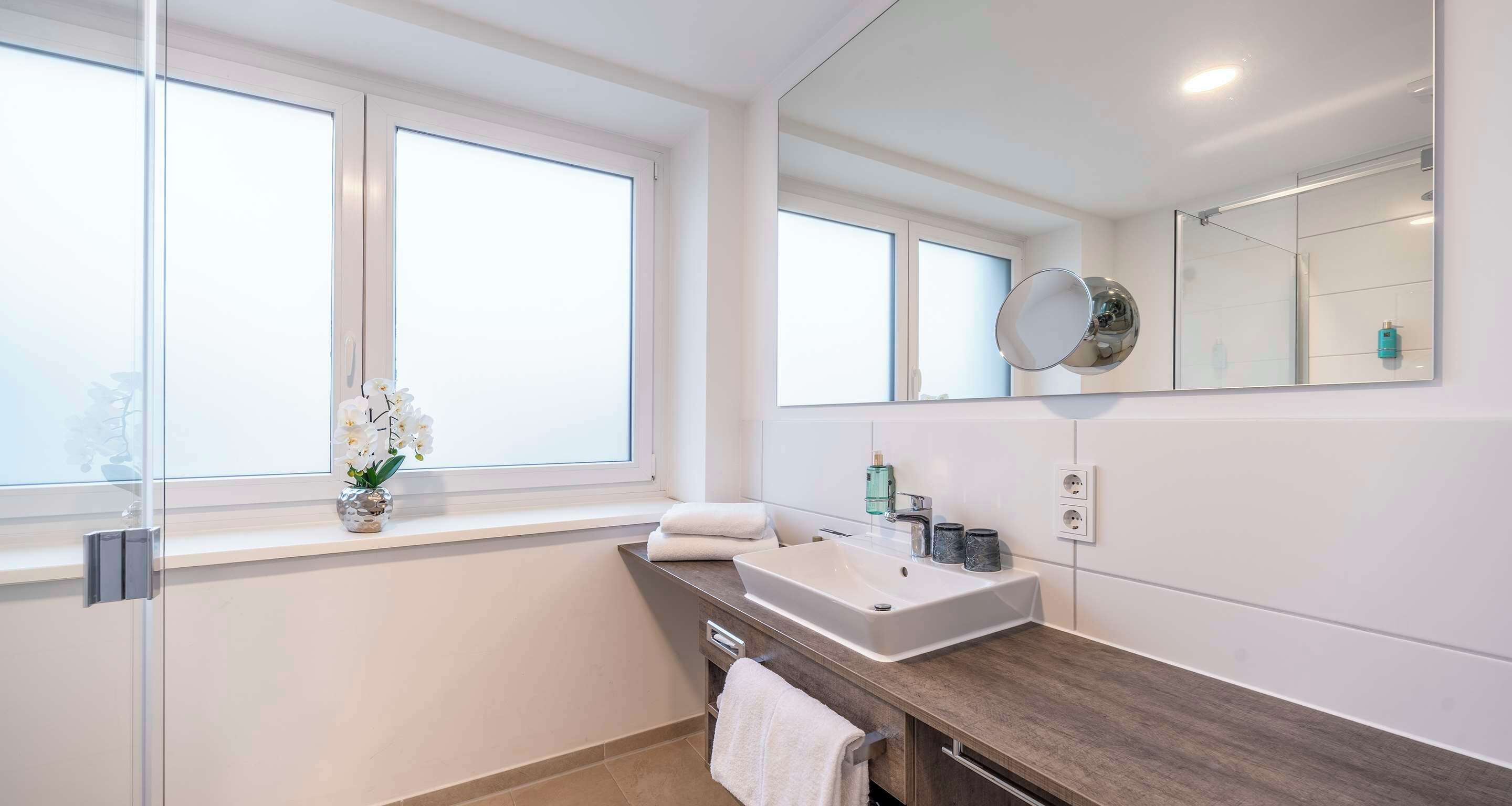 junior suite, 1 king bed | bathroom | shower, rainfall showerhead, hair dryer, towels