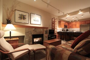 Studio Suite, 1 Queen Bed with Sofa bed, Ground Floor | Living area | TV, fireplace - Symphony Condos by Whistler Retreats (Whistler)