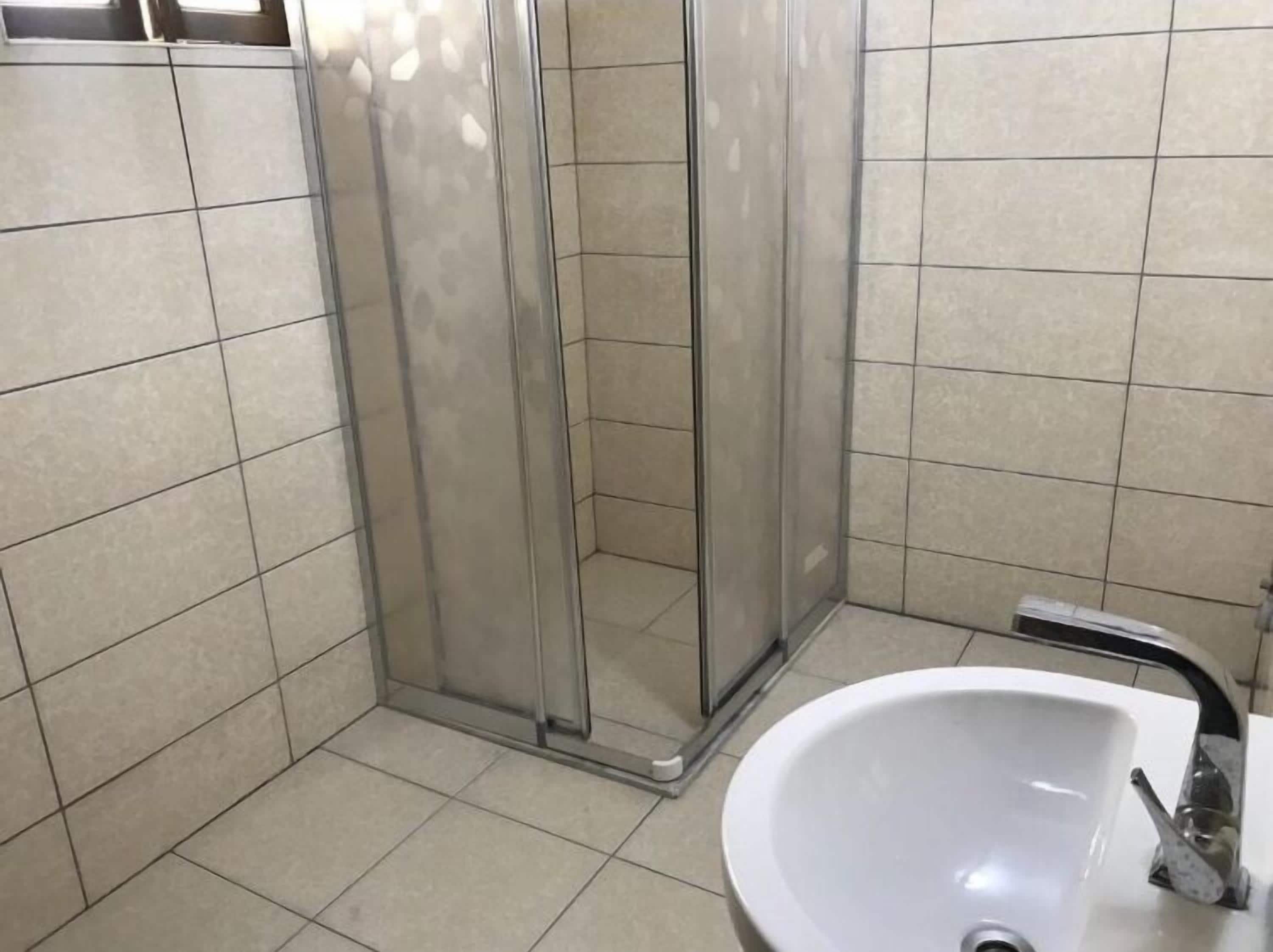 family quadruple room | bathroom | shower, hair dryer, slippers, towels