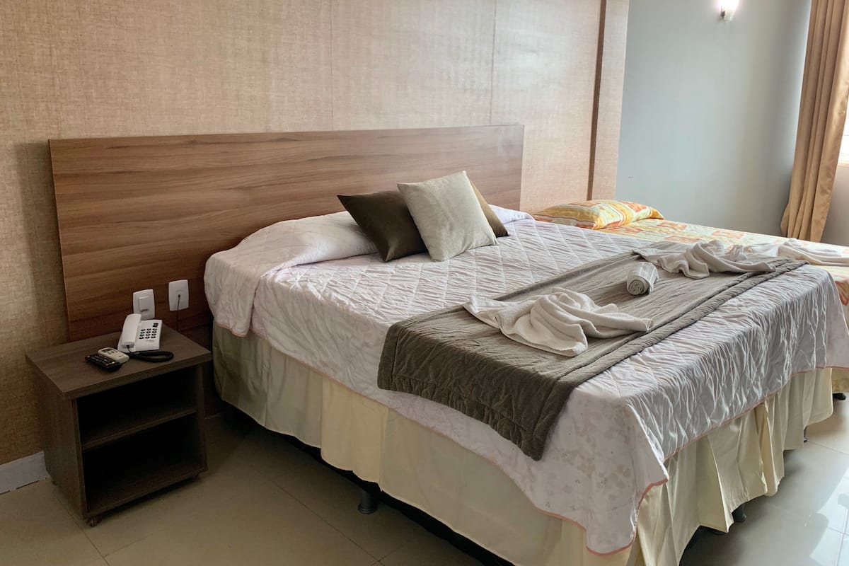 Standard Triple Room | Blackout drapes, iron/ironing board, bed sheets