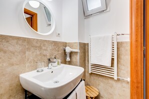 Shower, eco-friendly toiletries, hair dryer, bidet