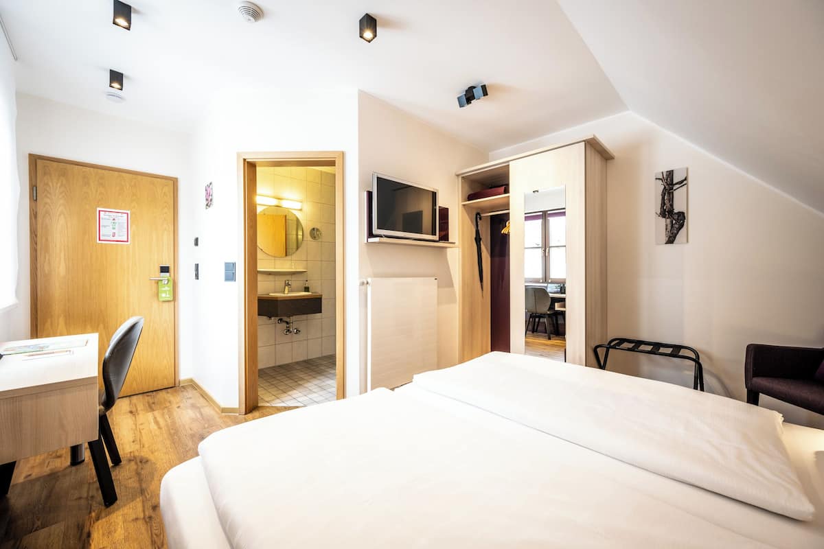 classic double room, courtyard area | in-room safe, free wifi, bed sheets, wheelchair access