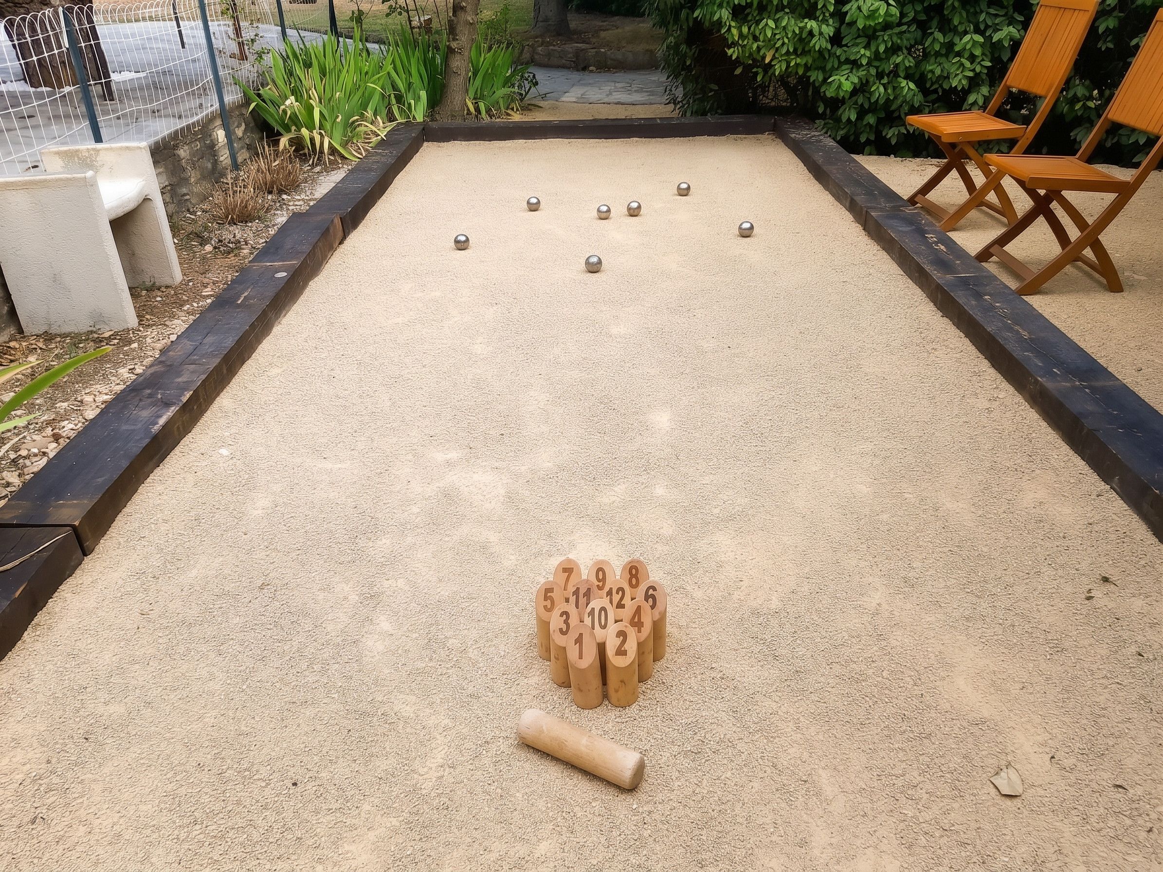 A bocce court with numbered pallies and a jack in the center.
