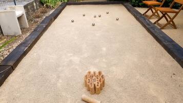 A bocce court with numbered pallies and a jack in the center.