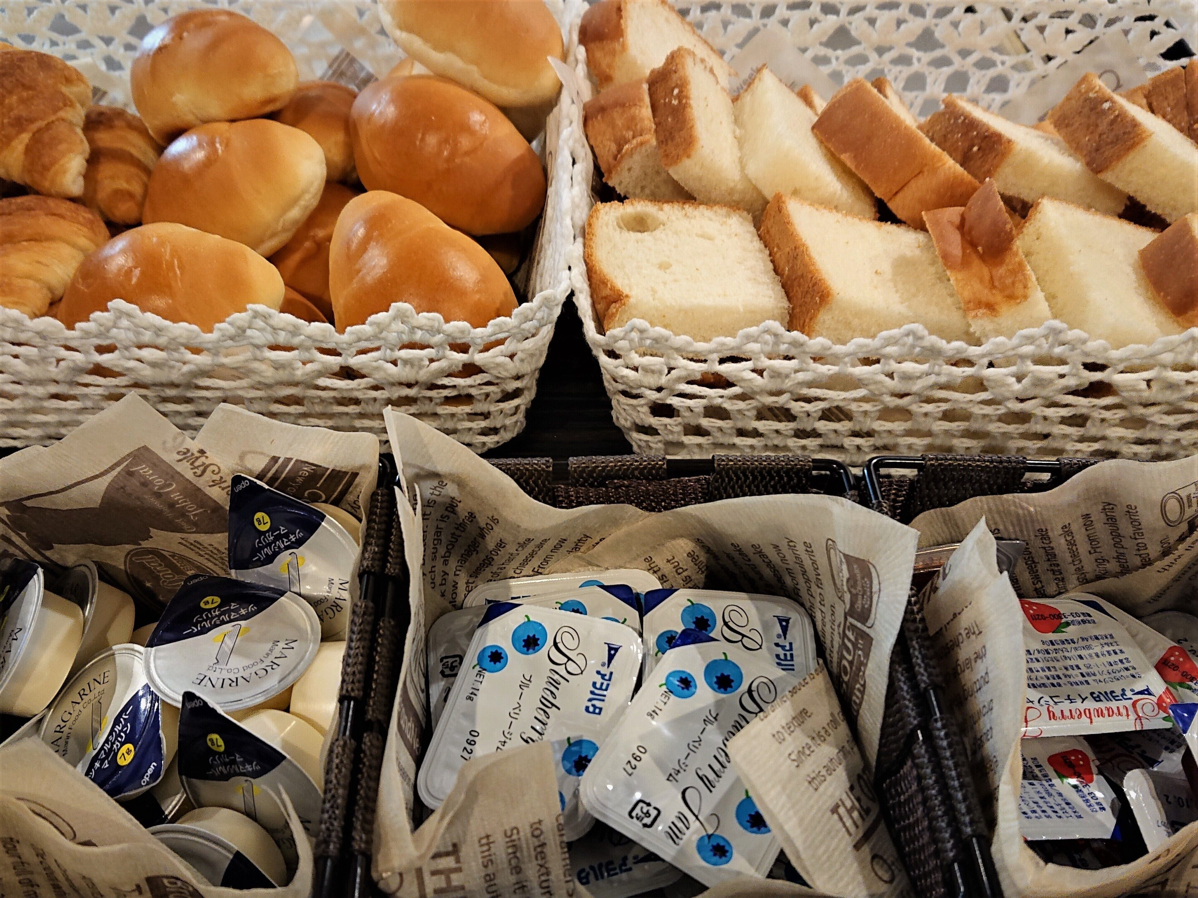 Baskets of bread, pastries, and packaged dairy products.