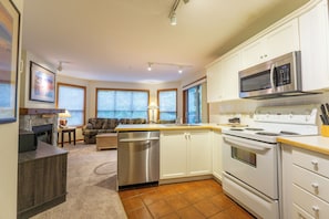 Enjoy cooking in the well-equipped kitchen with appliances and dining area.