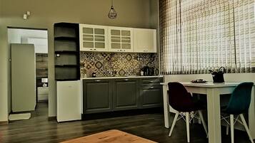 Apartment, 1 Bedroom, Ground Floor | Desk, laptop workspace, soundproofing, iron/ironing board