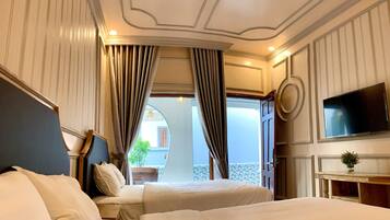Deluxe Twin Room, Pool View | Living area | 42-inch flat-screen TV with cable channels, TV