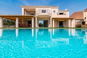 Outdoor pool, pool umbrellas, pool loungers