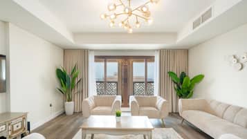 Luxury Apartment, 2 Bedrooms, Sea View (Palm View) | Living area | 55-inch Smart TV with cable channels