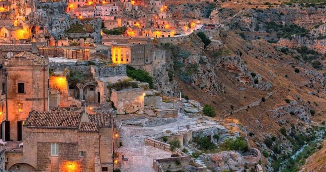 A mountainous village with stone buildings and narrow pathways.
