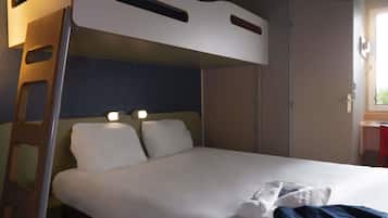 A bunk bed with a ladder, a bedside table, and a window with daylight.