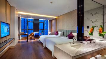 Deluxe Twin Room | Minibar, in-room safe, desk, iron/ironing board