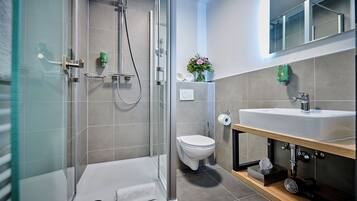 Shower, rainfall showerhead, hair dryer, towels