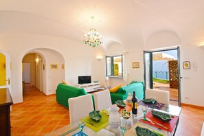 Duplex, 4 Bedrooms | Living room | Flat-screen TV