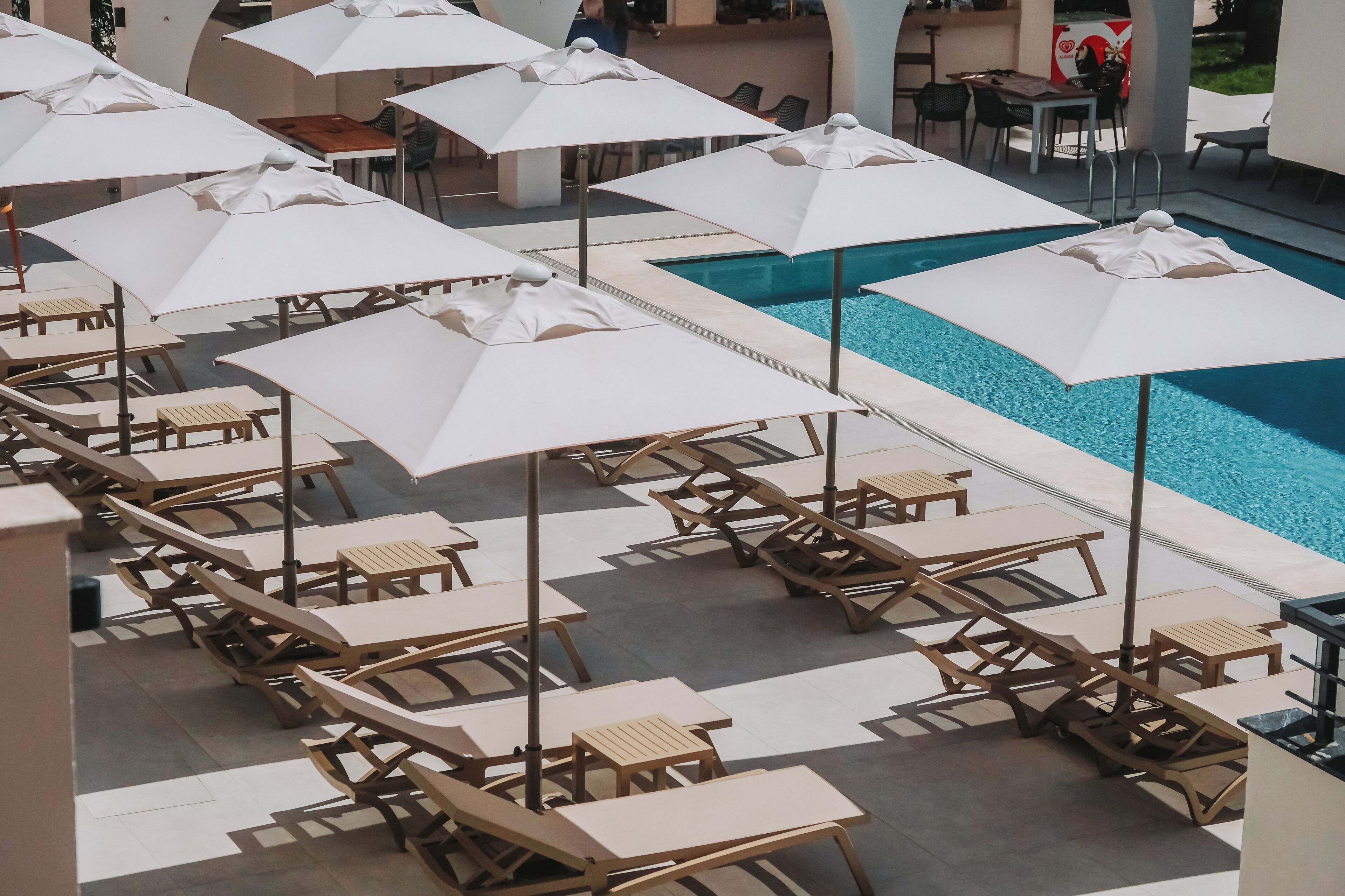 Seasonal outdoor pool, pool umbrellas, pool loungers