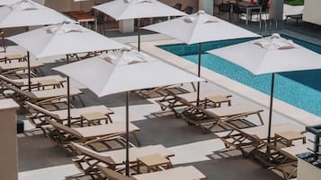 Seasonal outdoor pool, pool umbrellas, pool loungers