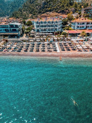 On the beach, free beach cabanas, beach shuttle, sun loungers