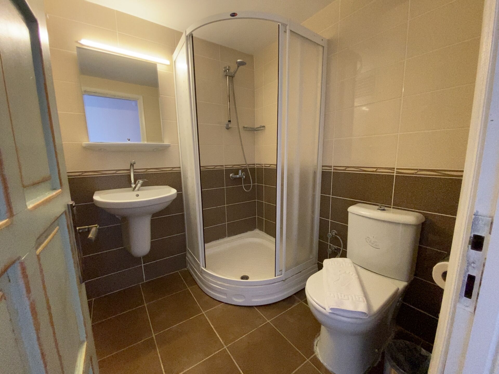 shower, rainfall showerhead, hair dryer, towels