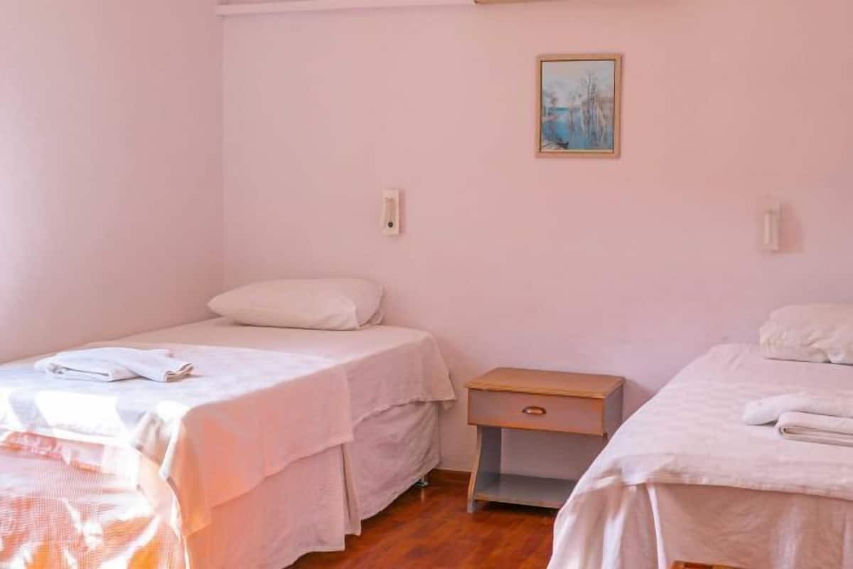 2 bedrooms, blackout drapes, soundproofing, iron/ironing board