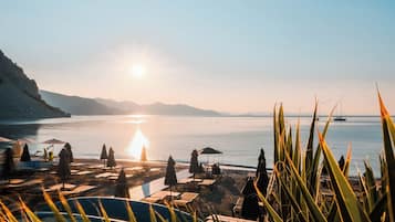 On the beach, free beach cabanas, beach shuttle, sun-loungers