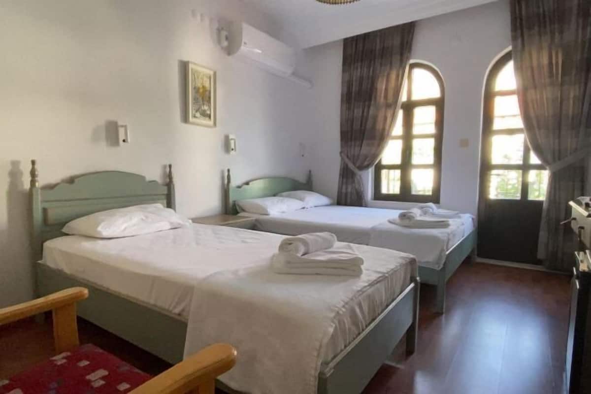 2 bedrooms, blackout drapes, soundproofing, iron/ironing board