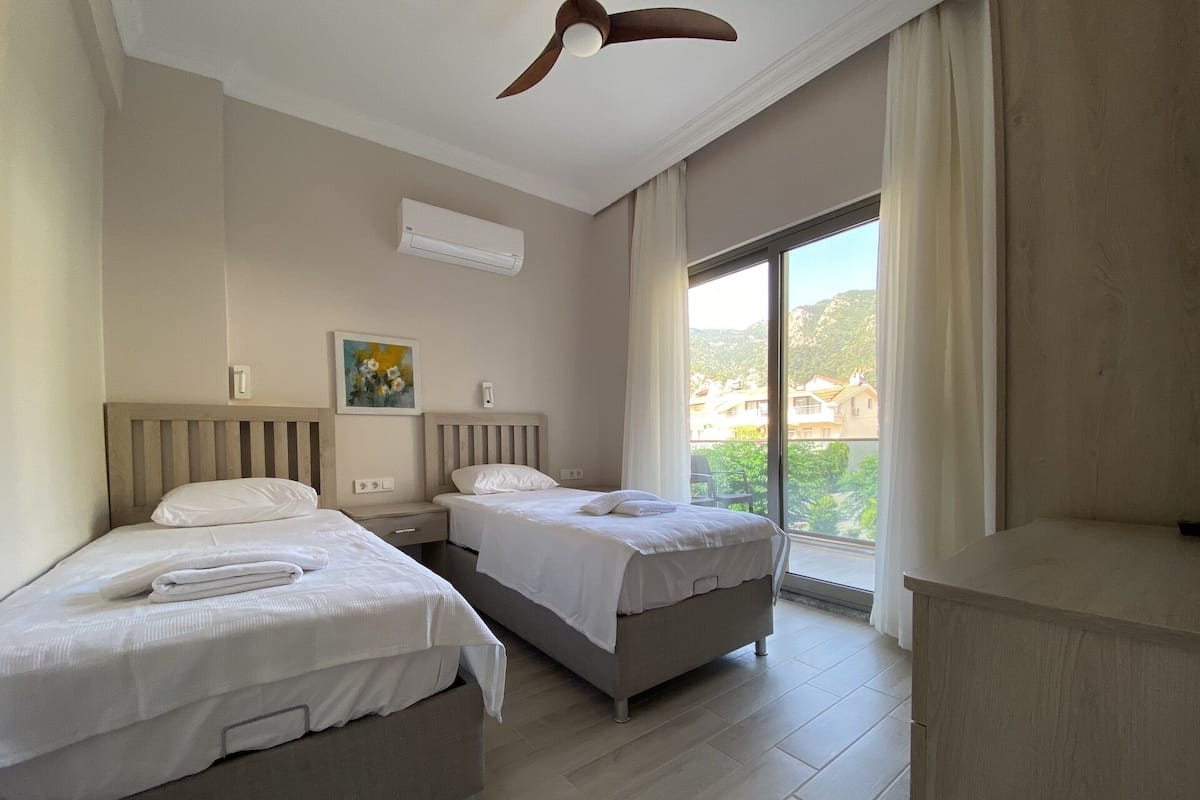 2 bedrooms, blackout curtains, soundproofing, iron/ironing board