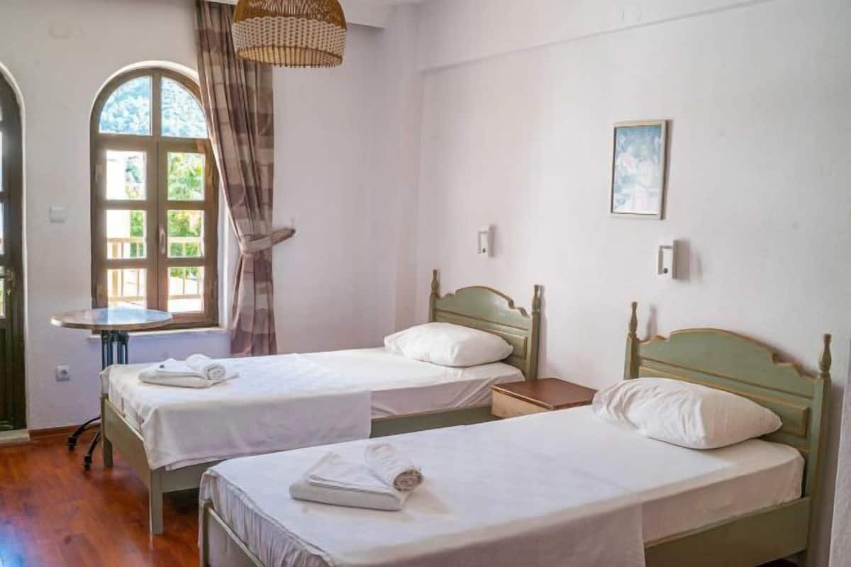 2 bedrooms, blackout drapes, soundproofing, iron/ironing board