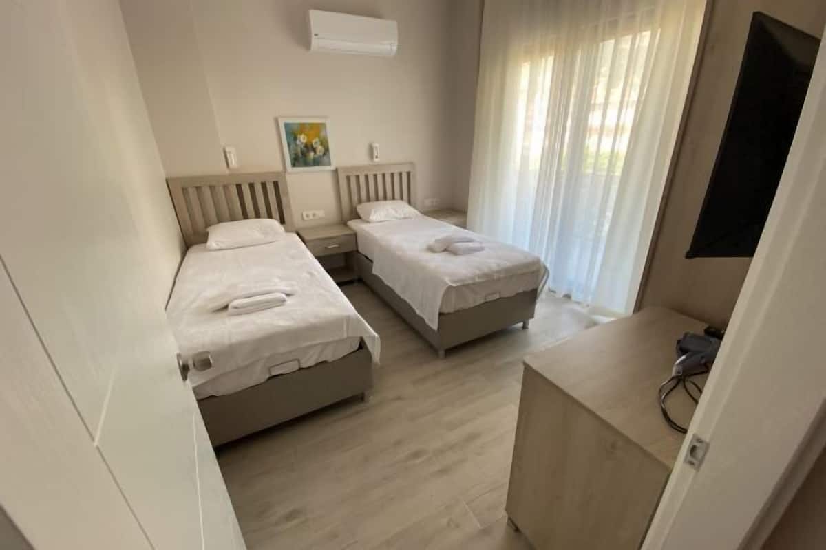 2 bedrooms, blackout curtains, soundproofing, iron/ironing board