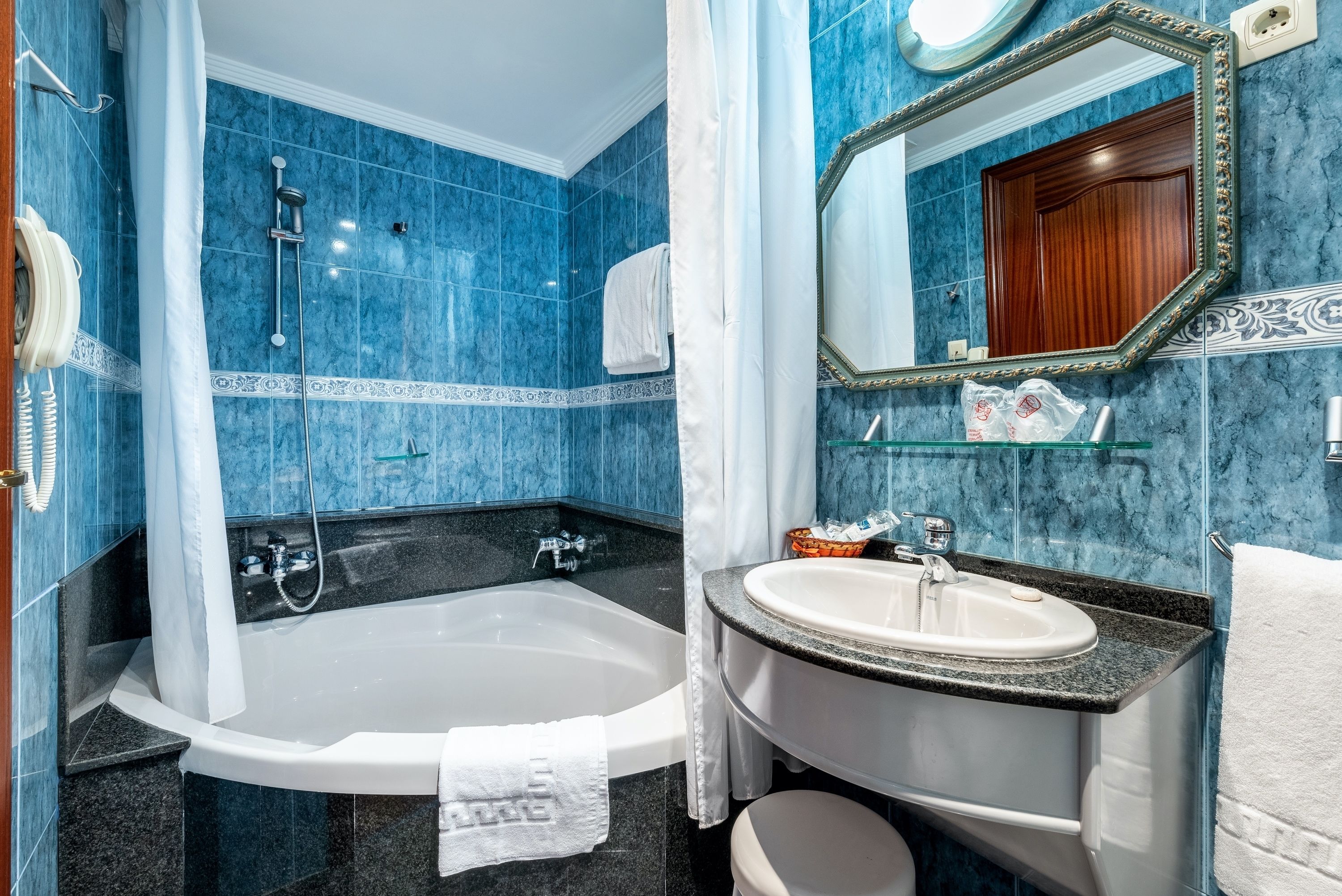 junior suite | bathroom | rainfall showerhead, free toiletries, towels