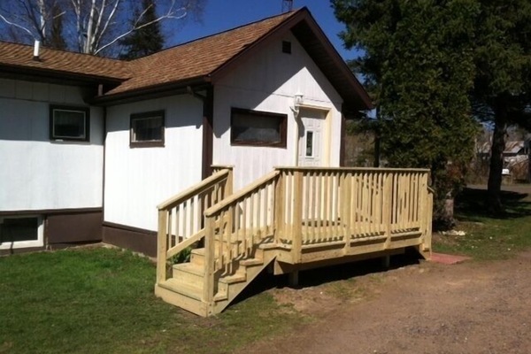 Enter on a front deck into an entryway. Continue to main floor or lower level.