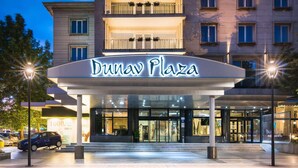 The exterior of Dunav Plaza hotel with a modern entrance and illuminated signage. - Dunav Plaza Hotel (Ruse)