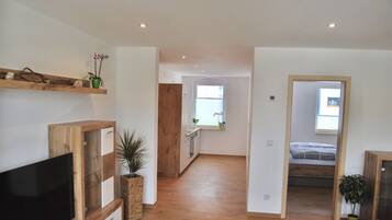 Comfort Apartment, 1 Bedroom, Balcony (WE3) | Living area | 40-inch flat-screen TV with cable channels, TV, heated floors