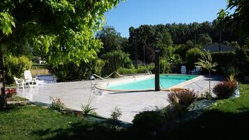 Seasonal outdoor pool, open 10:00 AM to 7:00 PM, sun loungers