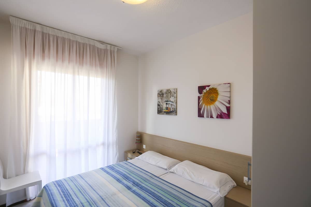 Apartment, 1 Bedroom | 2 bedrooms, blackout curtains, cots/infant beds, bed sheets