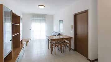 Apartment, 1 Bedroom | Living area | 22-inch TV with digital channels