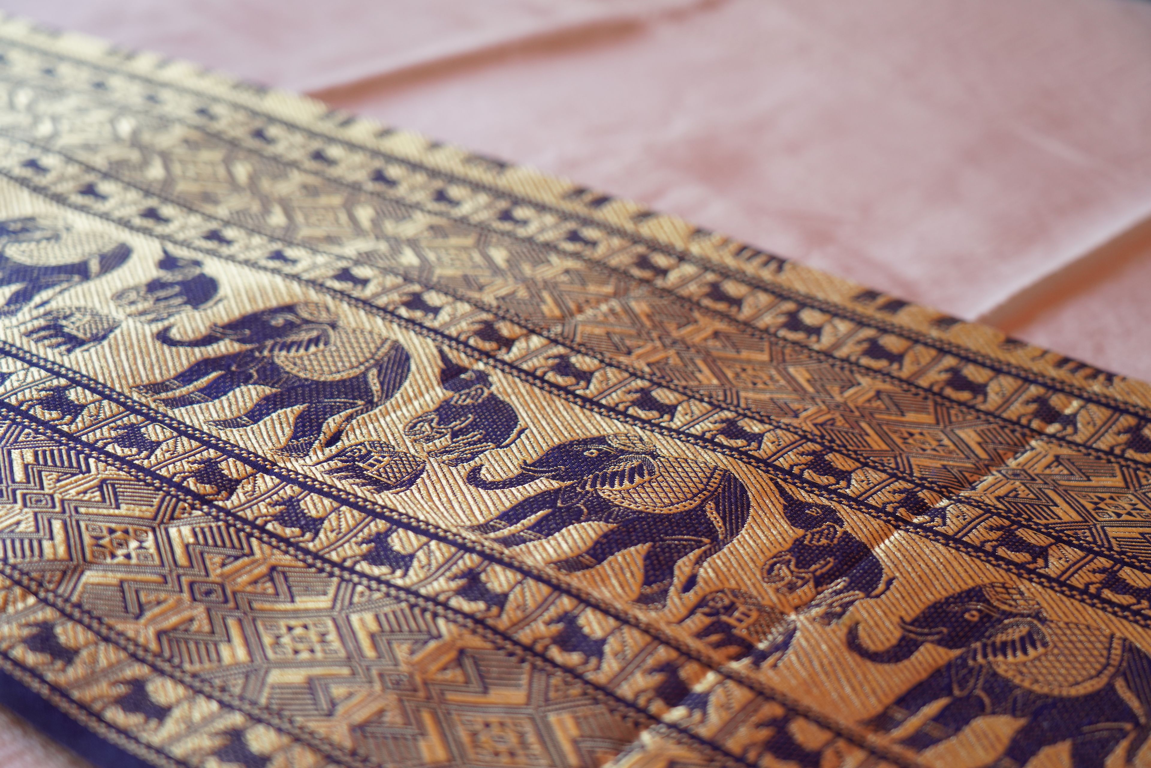 A close-up of a patterned fabric with intricate designs.
