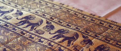 A close-up of a patterned fabric with intricate designs.