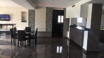 Apartment, 3 Bedrooms | Living area | Flat-screen TV