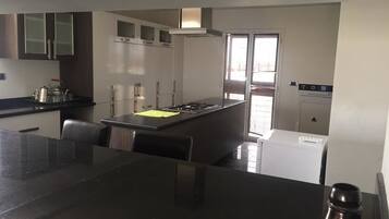 Apartment, 3 Bedrooms | Private kitchen | Fridge, microwave, oven, stovetop