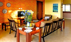 Deluxe Villa | Living area | 32-inch flat-screen TV with satellite channels, TV - Casa Bul-Kay's- Where Confort Meets Consierge Care (Dzemul)