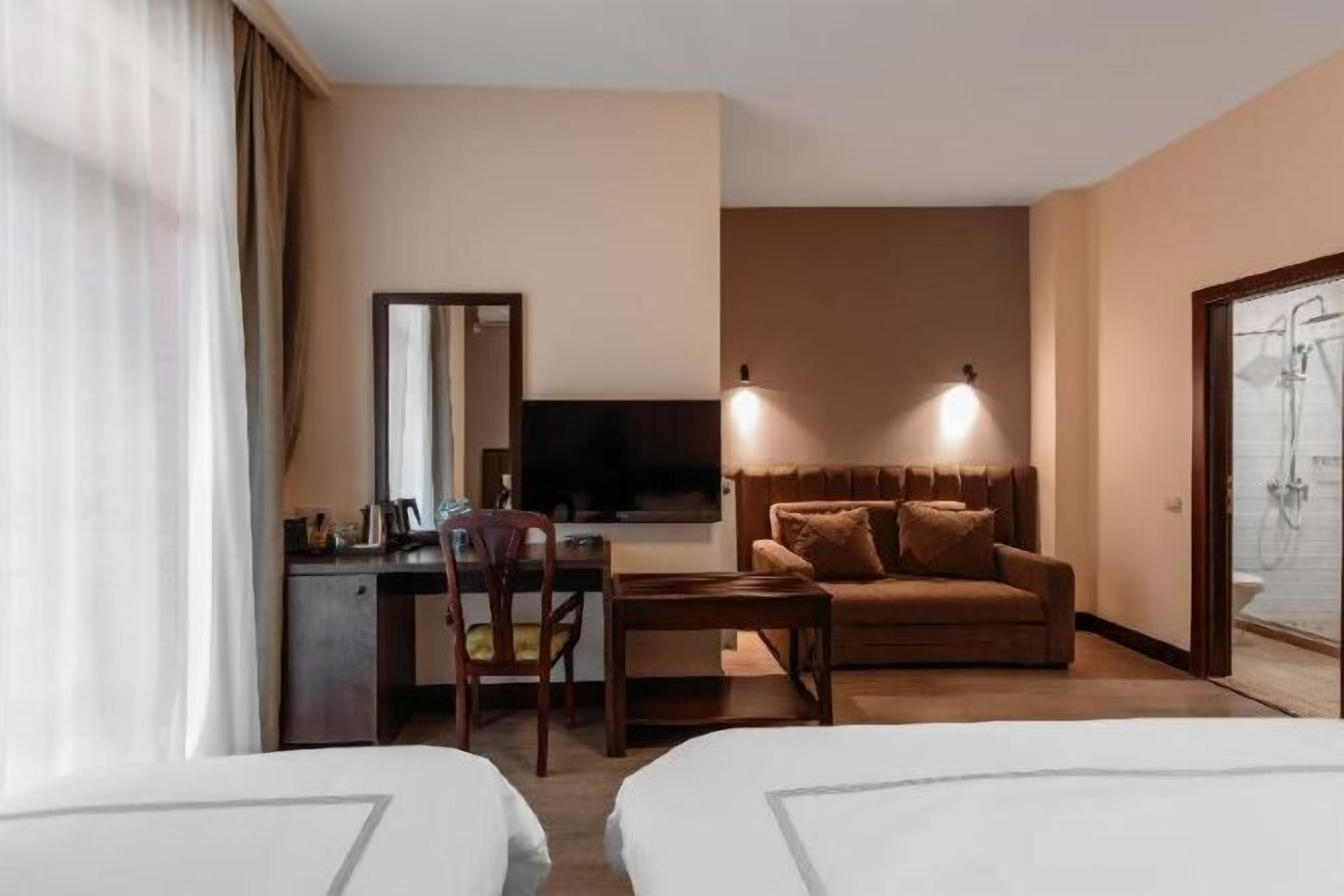 Luxe beddengoed, bedden met traagschuimmatrassen, een minibar