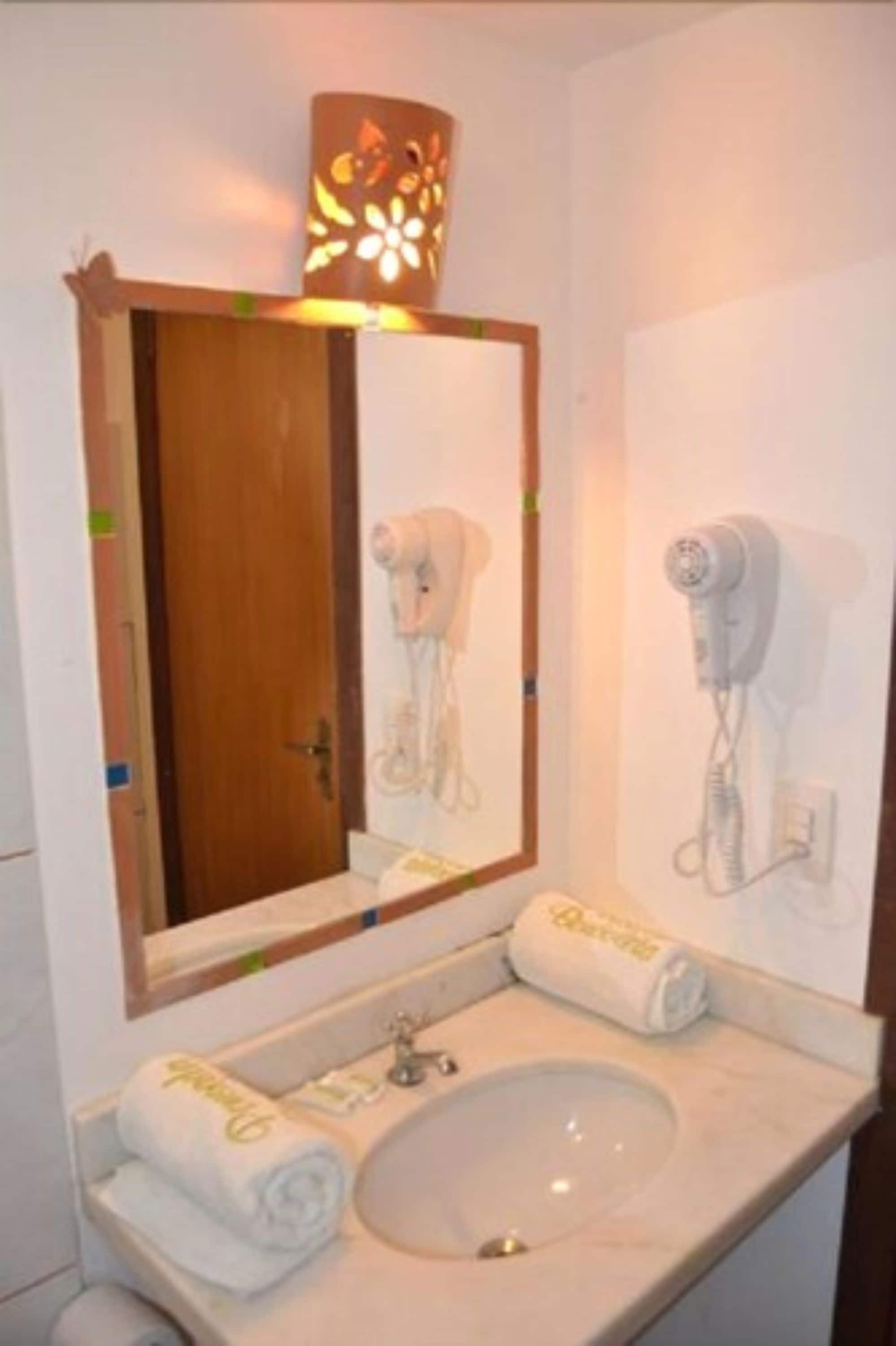room, garden view | bathroom | shower, hair dryer, towels