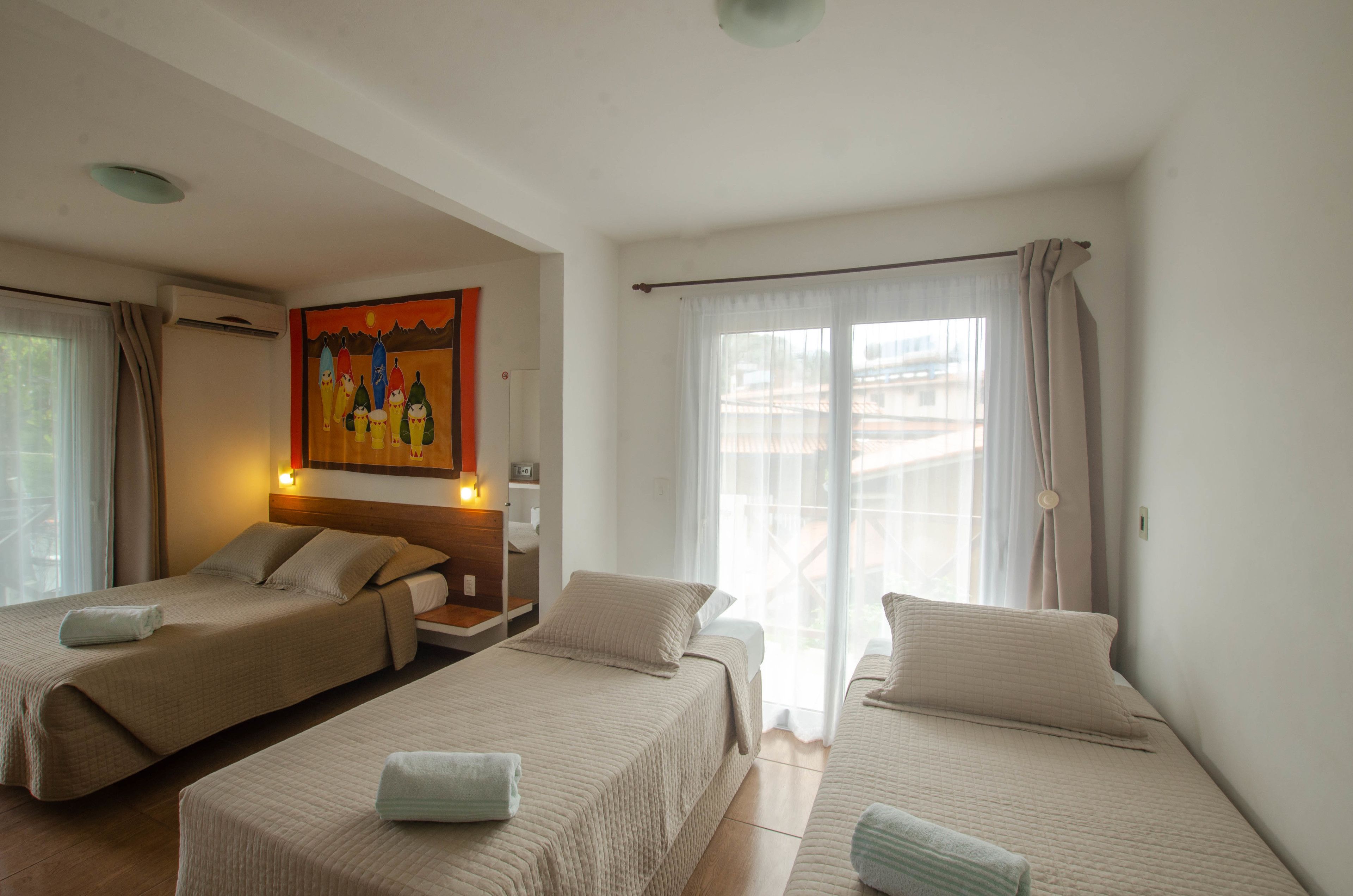 quadruple room | minibar, in-room safe, desk, blackout curtains