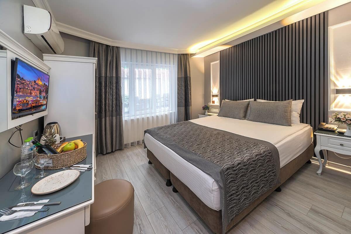 Economy Double Room, Courtyard View | Premium bedding, minibar, in-room safe, laptop workspace