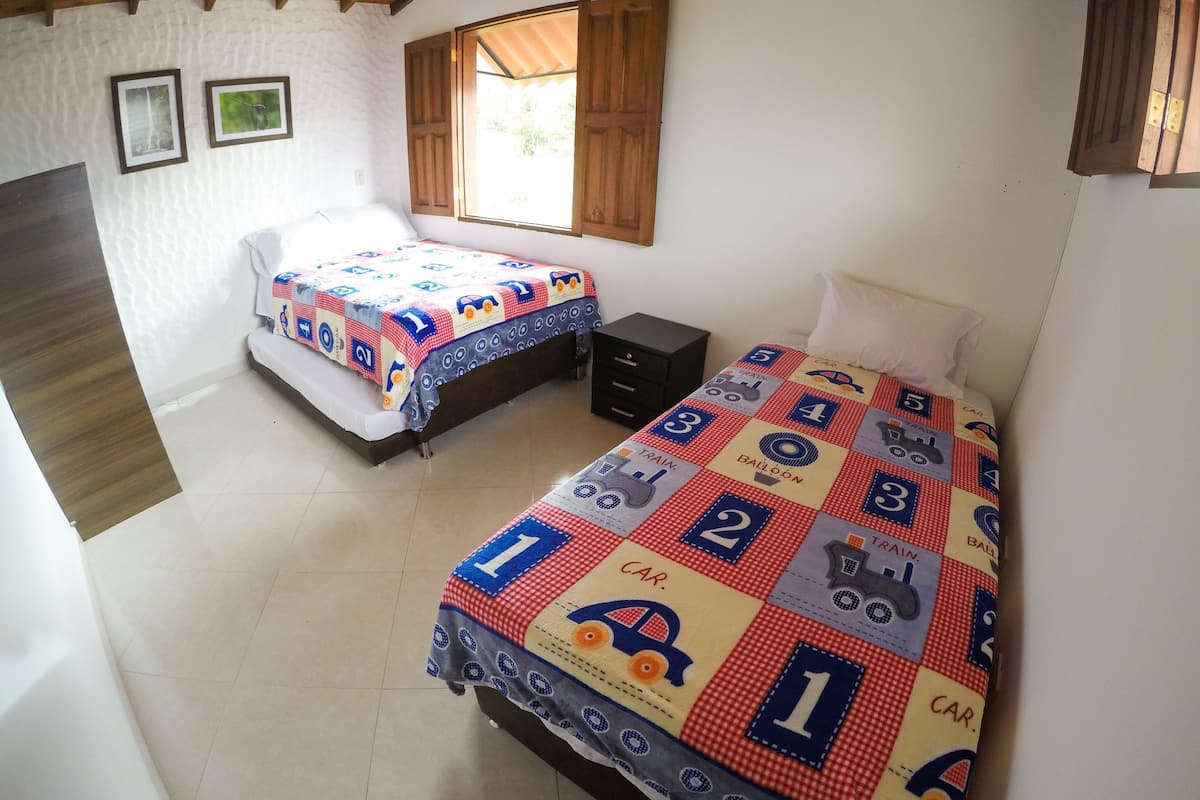 Family Room | Laptop workspace, bed sheets