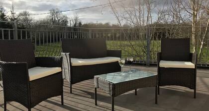 Ballygown Cottage with views across open countryside out to the mountains